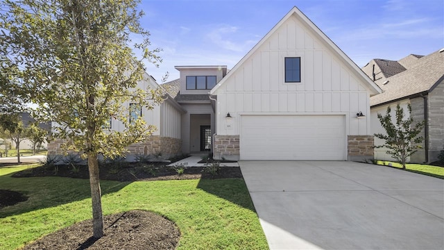 view of front of property with a front yard and a garage