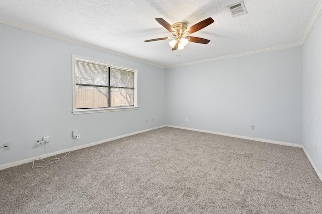 carpeted empty room featuring ceiling fan, crown molding, and a textured ceiling