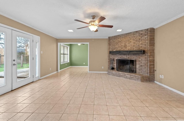 unfurnished living room with light tile patterned floors, ceiling fan, a fireplace, a textured ceiling, and french doors