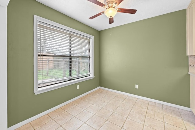 unfurnished room featuring light tile patterned flooring and ceiling fan