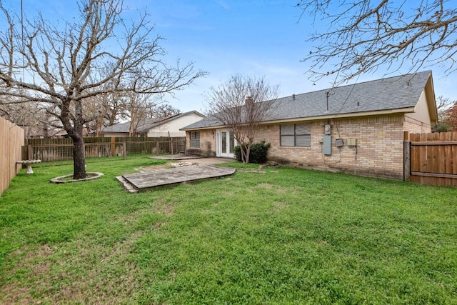 back of house with a yard