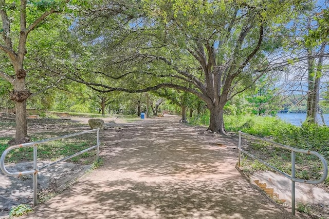 surrounding community with a water view