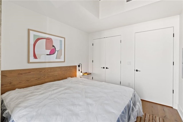 bedroom featuring a closet and wood finished floors