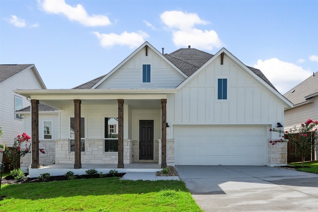 view of front of property with covered porch and a front yard