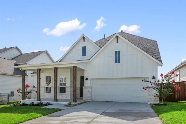 view of front facade with a garage and covered porch