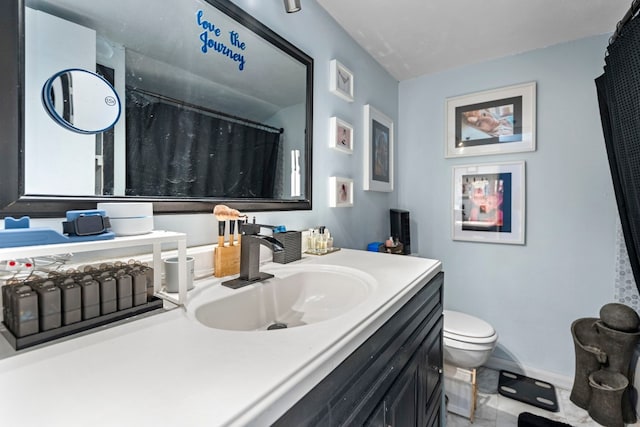269 Venture Blvd S, Leander, TX 78645 - full bathroom with toilet, vanity, and baseboards