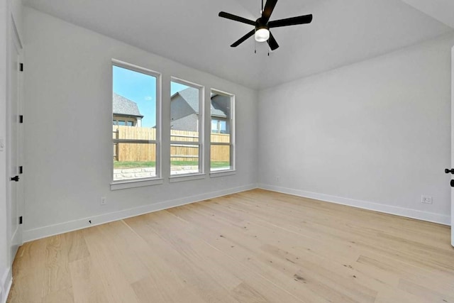 empty room featuring ceiling fan and light hardwood / wood-style flooring