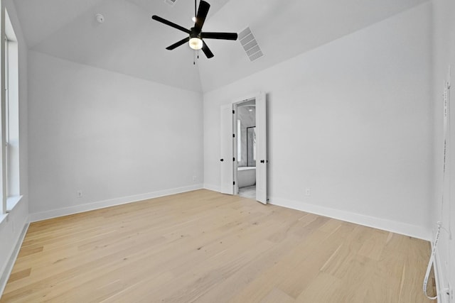 unfurnished room with light hardwood / wood-style floors, vaulted ceiling, and ceiling fan