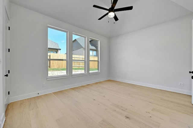 empty room with light wood-type flooring and ceiling fan