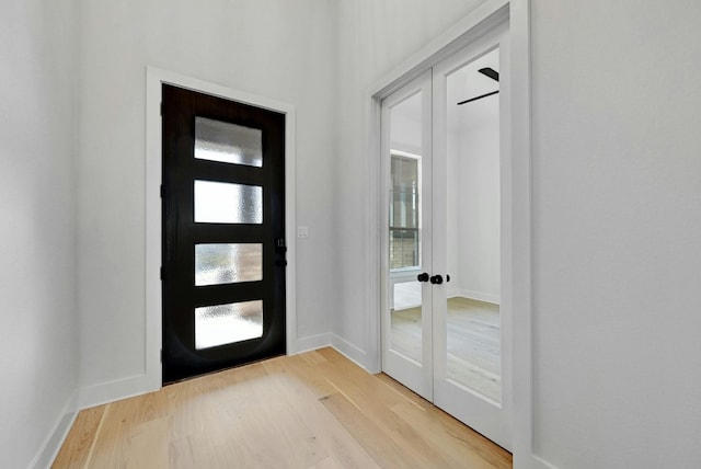 foyer entrance with plenty of natural light and light wood-type flooring