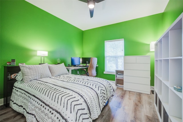 bedroom with ceiling fan and hardwood / wood-style floors