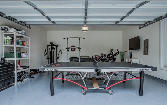 interior space with a garage door opener and electric panel