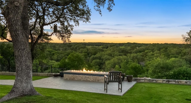 view of community featuring a patio area and a yard