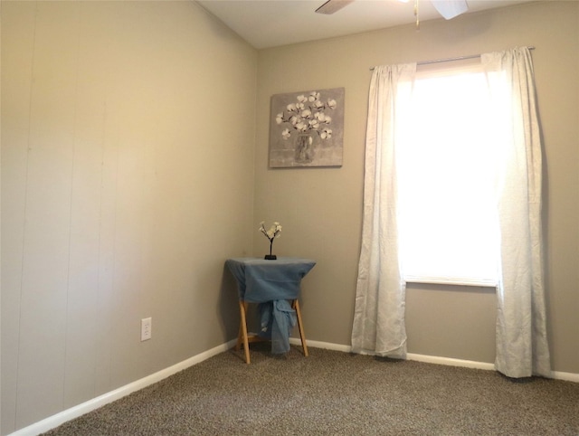 carpeted empty room with ceiling fan