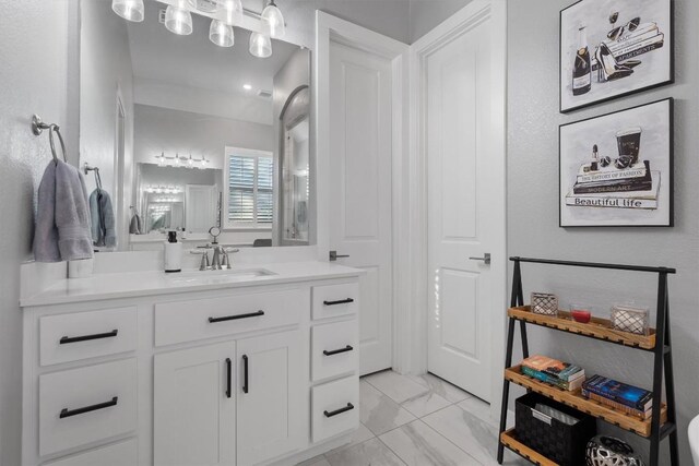 bathroom featuring tile patterned flooring and vanity