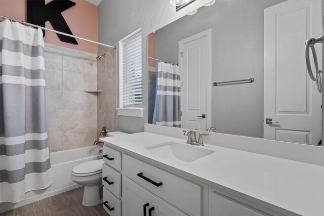 full bathroom with vanity, toilet, and shower / bath combo with shower curtain