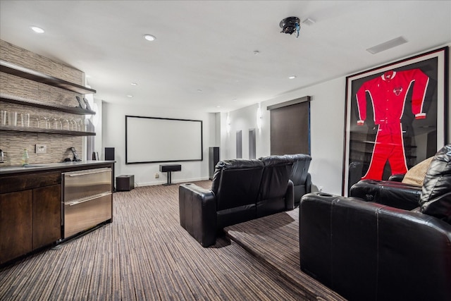 home theater featuring bar area and carpet floors