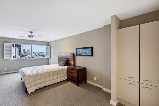 bedroom with ceiling fan and carpet flooring