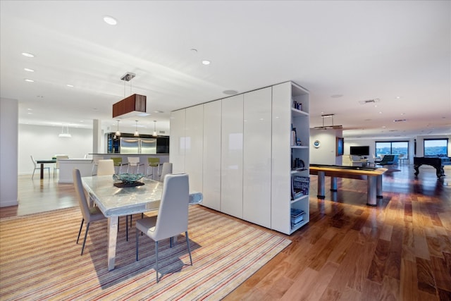 dining area featuring light wood-type flooring