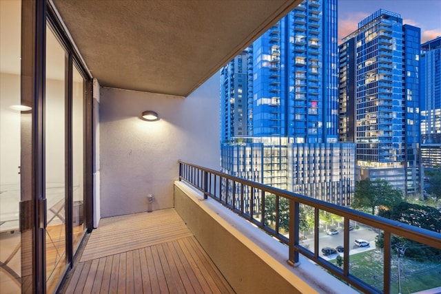 view of balcony at dusk