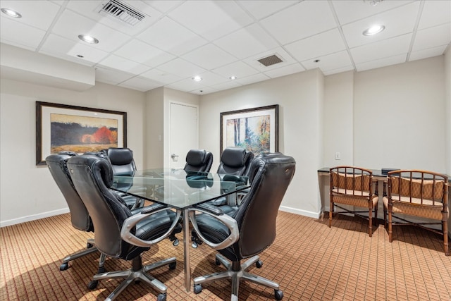 carpeted home office featuring a paneled ceiling