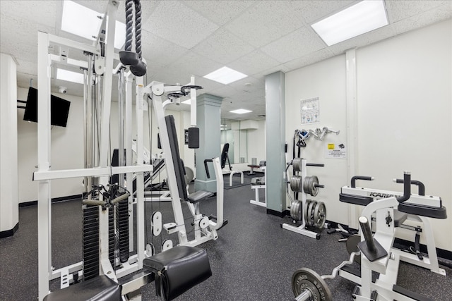 gym featuring a paneled ceiling