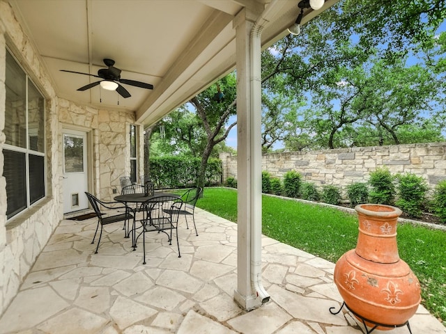 view of patio featuring ceiling fan