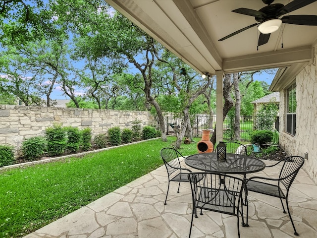 view of patio featuring ceiling fan