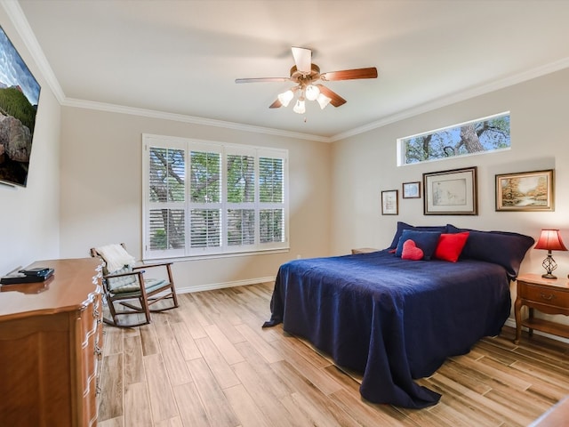 bedroom with ceiling fan, light wood-type flooring, ornamental molding, and multiple windows