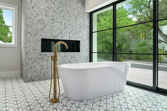 bathroom with tile patterned floors and a bathing tub