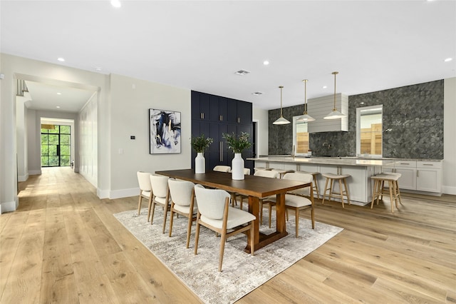 dining area with light wood-type flooring