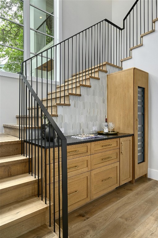 stairway featuring wood finished floors