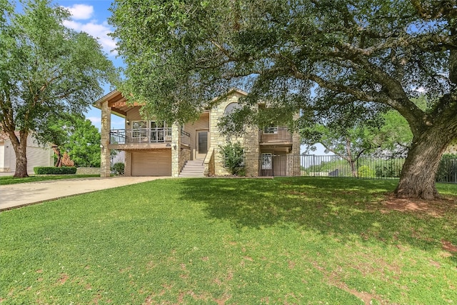 view of front of property featuring a front lawn and a garage