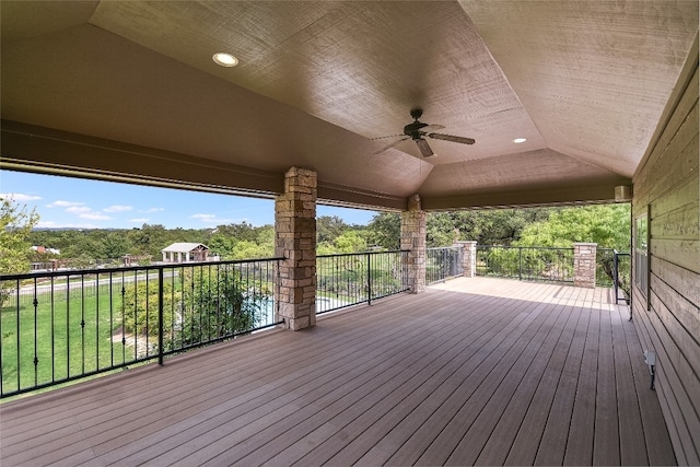 wooden deck featuring ceiling fan