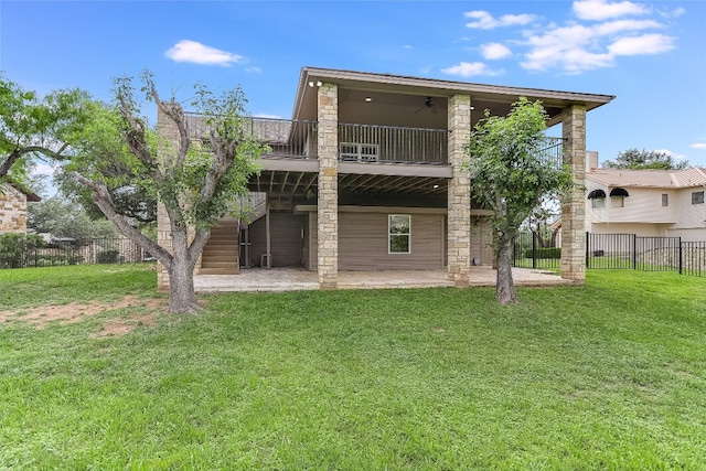 rear view of house featuring a yard and a patio area