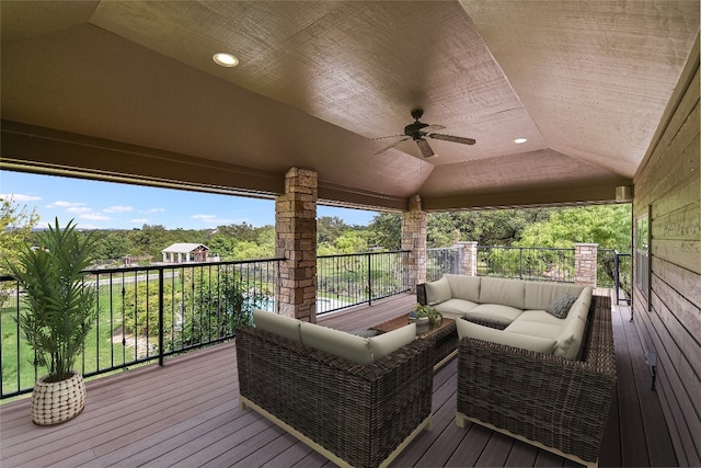 wooden terrace with outdoor lounge area and ceiling fan