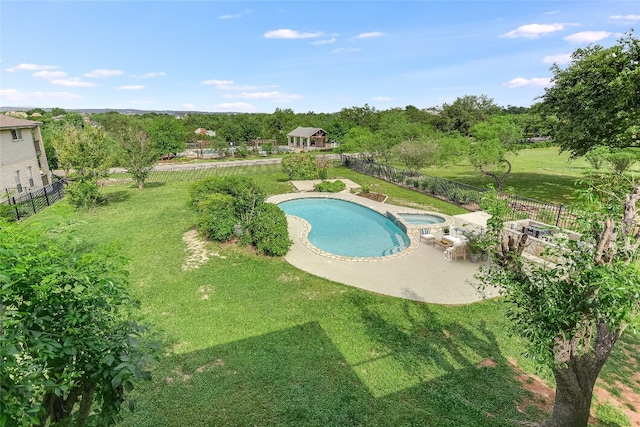 view of swimming pool featuring a patio and a lawn