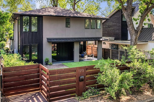 rear view of property featuring a patio