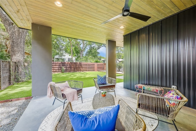 view of terrace with an outdoor living space and ceiling fan