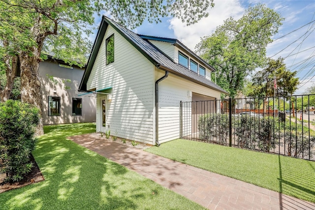 view of home's exterior with a yard