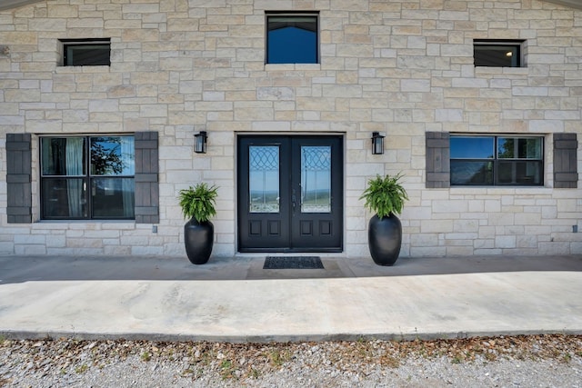 property entrance featuring french doors