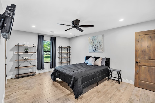 bedroom featuring ceiling fan and light hardwood / wood-style floors