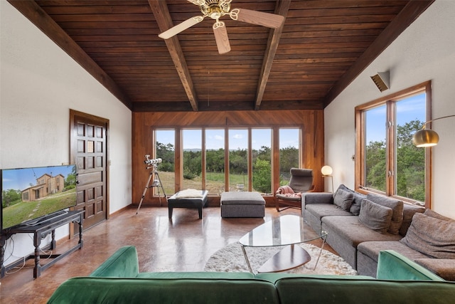 living room with concrete floors, ceiling fan, vaulted ceiling with beams, and wood ceiling