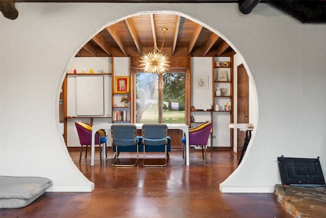 dining area with beam ceiling, a chandelier, concrete flooring, and wooden ceiling