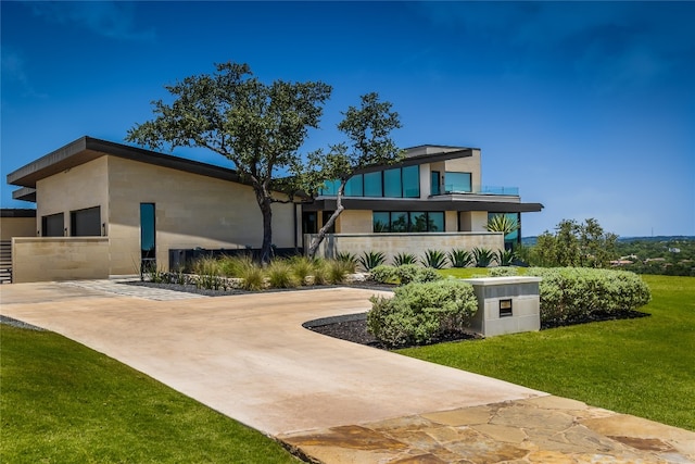 rear view of property with a yard