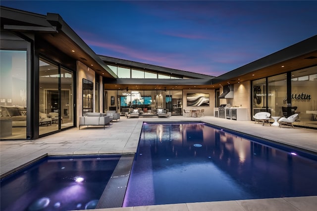 view of pool with a patio and area for grilling