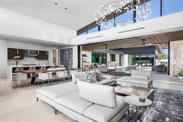 dining area featuring a towering ceiling and wood ceiling