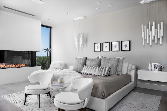 bedroom featuring floor to ceiling windows