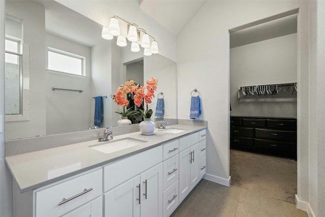 bathroom with tile patterned flooring and vanity