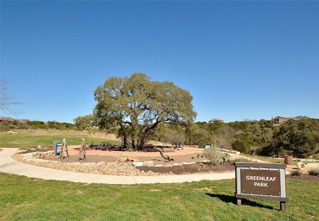 view of property's community with a lawn